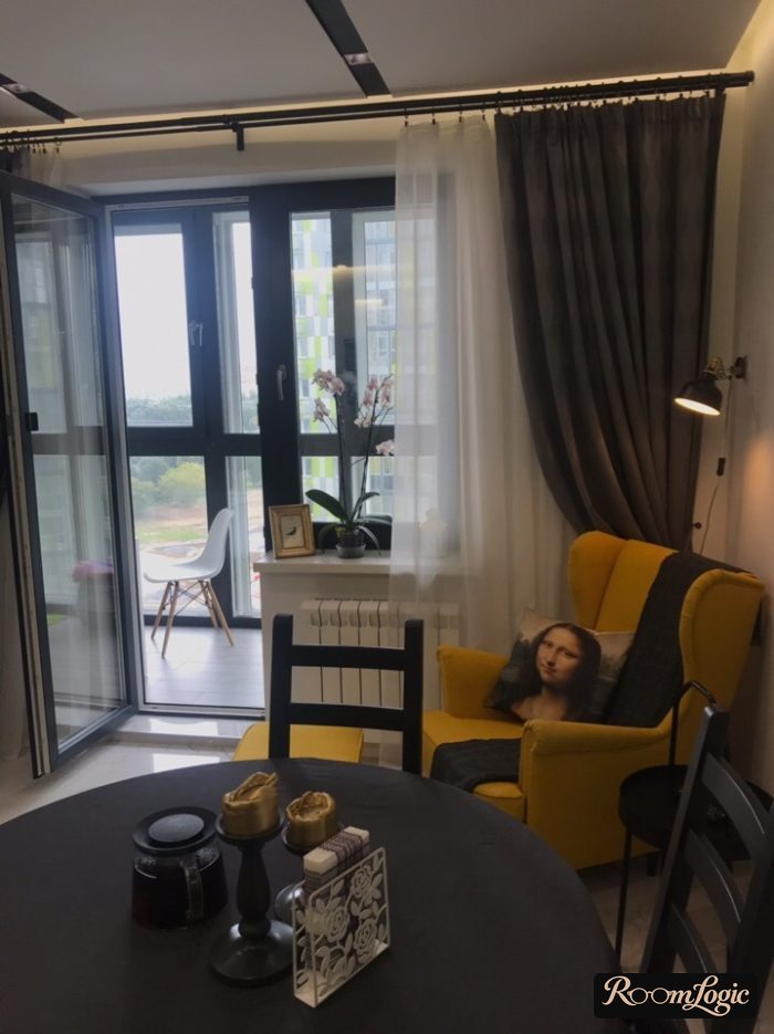 thick long curtains and sheer curtains on the window with a balcony