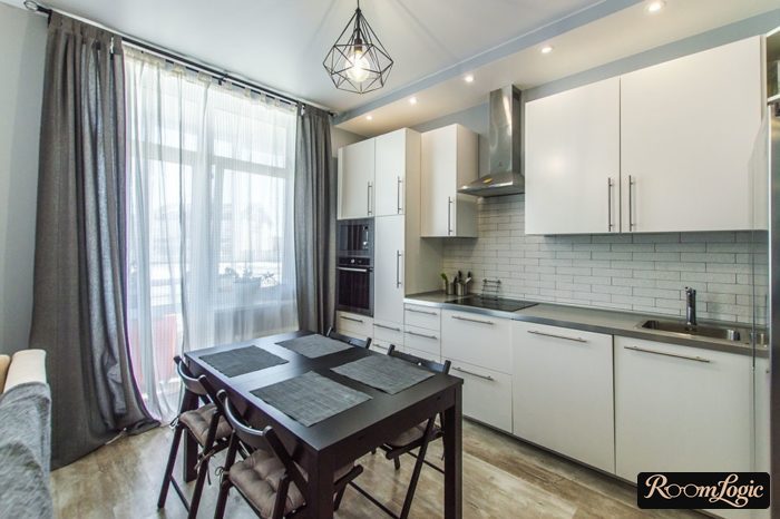 thin gray curtains on a white kitchen
