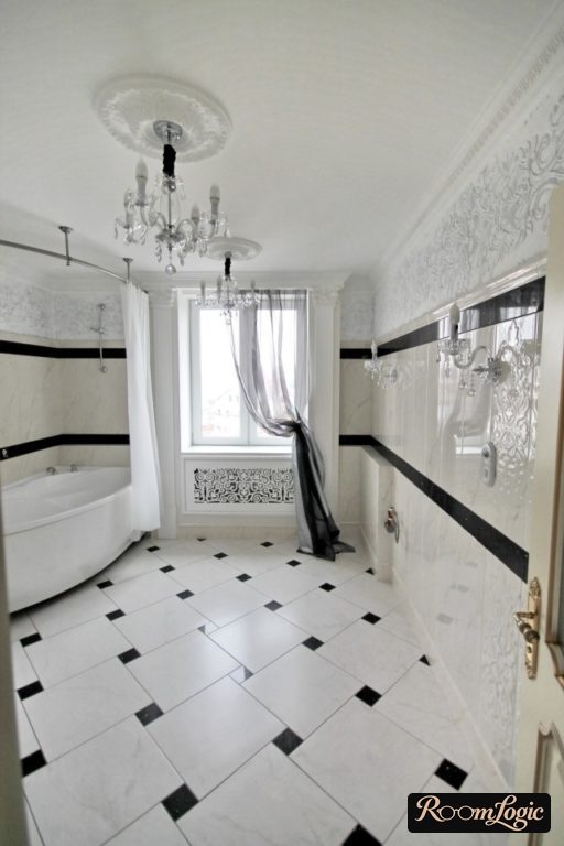 tile on the walls and floor in the bathroom