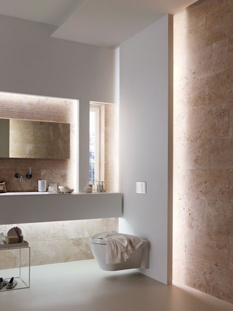 travertine tile in a niche with lighting design bathroom