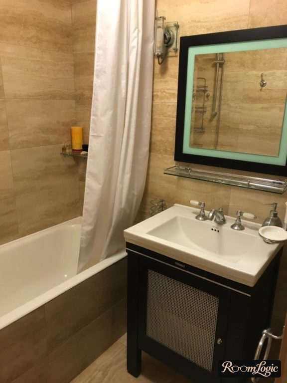 tile with stone pattern in bathroom of tiny apartment