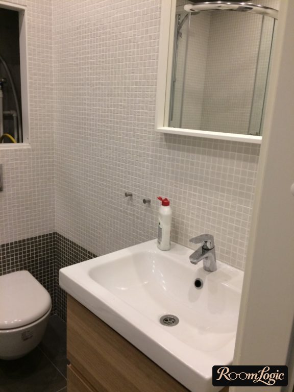 toilet in scandi style with white and black mosaic
