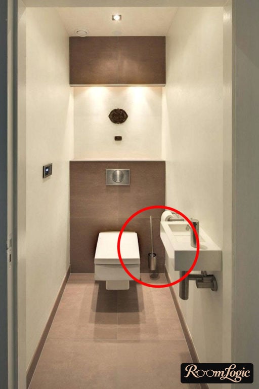 Toilet with a wall-mounted stainless-steel toilet brush