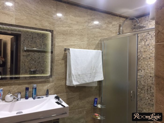 towel near shower in bathroom