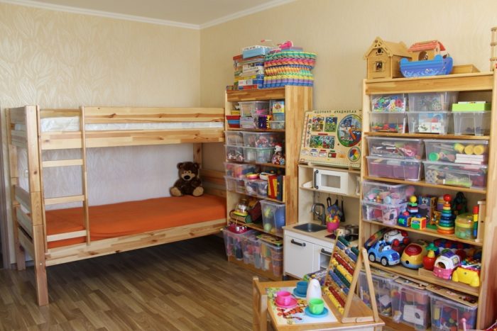 toy storage for two children in kids’ room