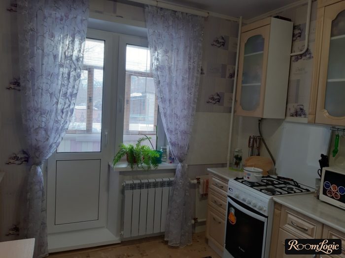 translucent curtains in the kitchen with a balcony