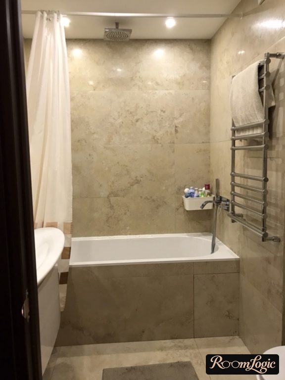 travertine tile in the interior of a small bathroom