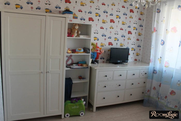 trucks wallpaper and white furniture in kids' room