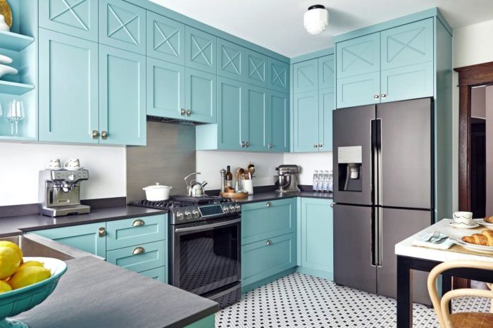 turquoise cabinet fronts with routed detailing in a concept kitchen in a Scandinavian style