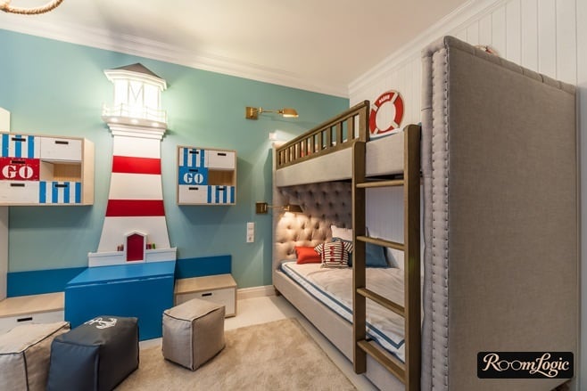 Turquoise wall and soft bunk bed in the kids’ room