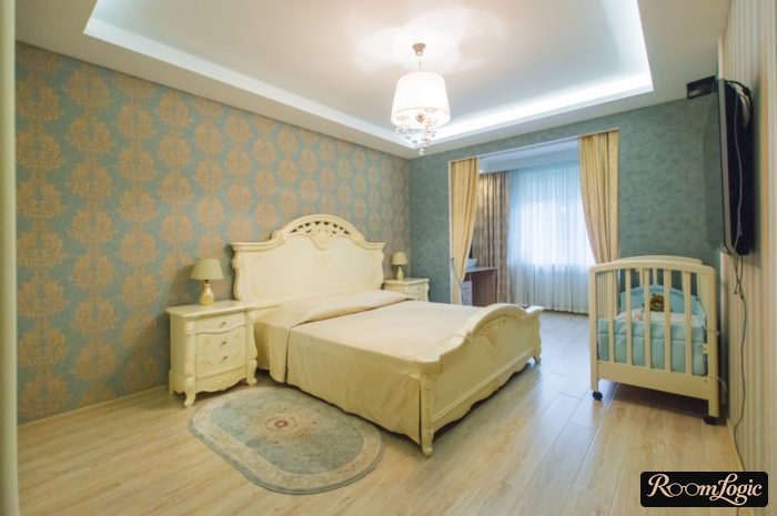 Turquoise wallpaper in the bedroom with a kids' bed