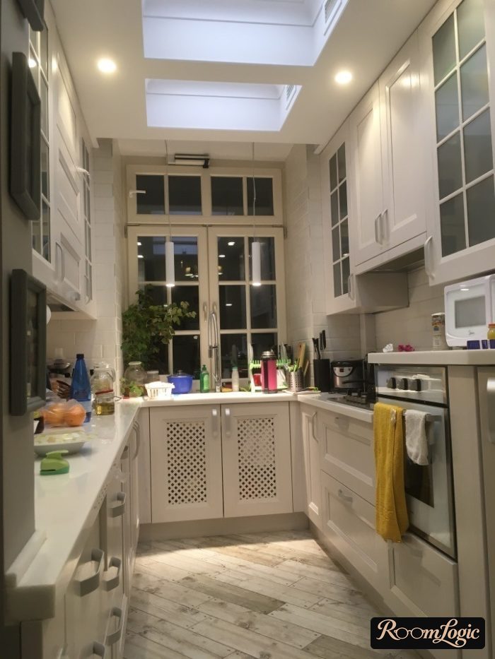 U-shaped kitchen in a Provence style in a country house