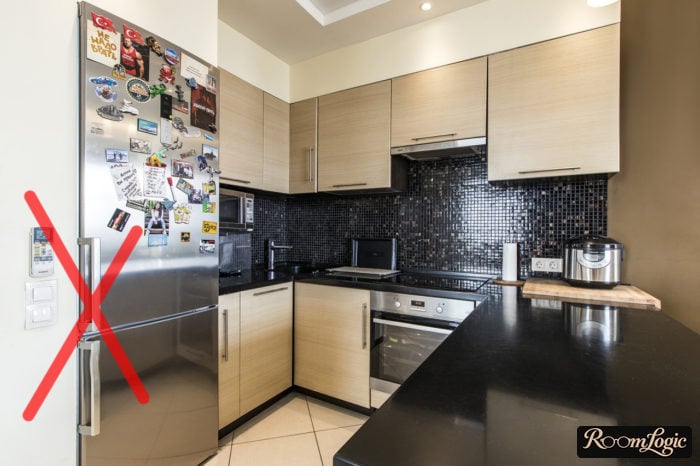 U-shaped kitchen with a regular refrigerator