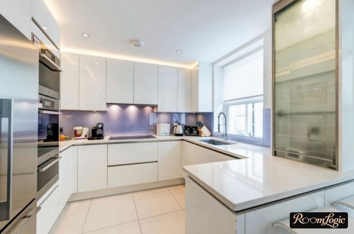 U-shaped kitchen with a window in the center