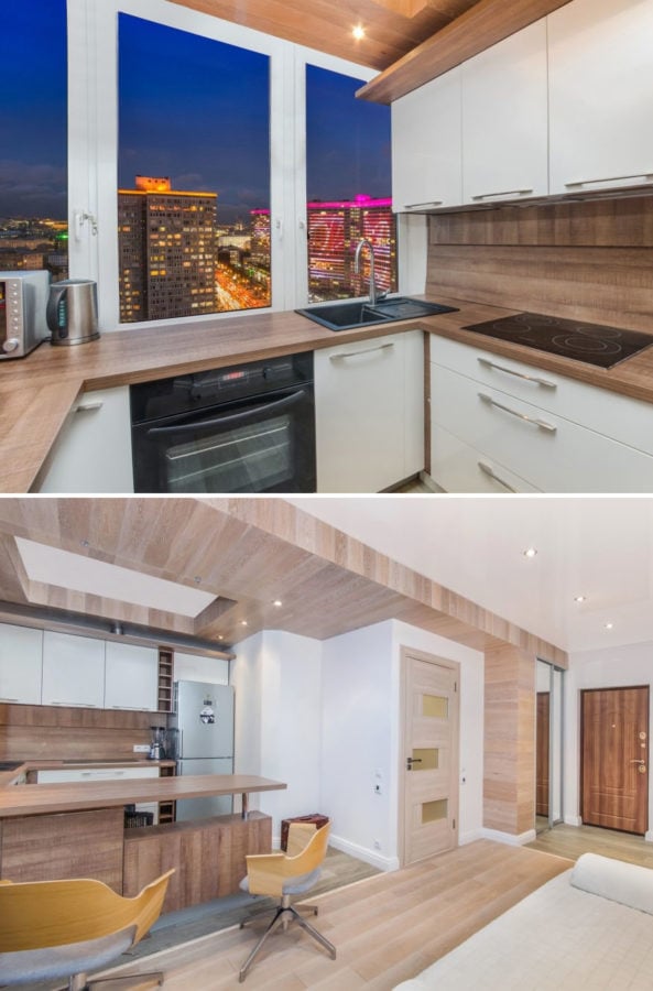 U-shaped kitchen with sink by the window and breakfast bar