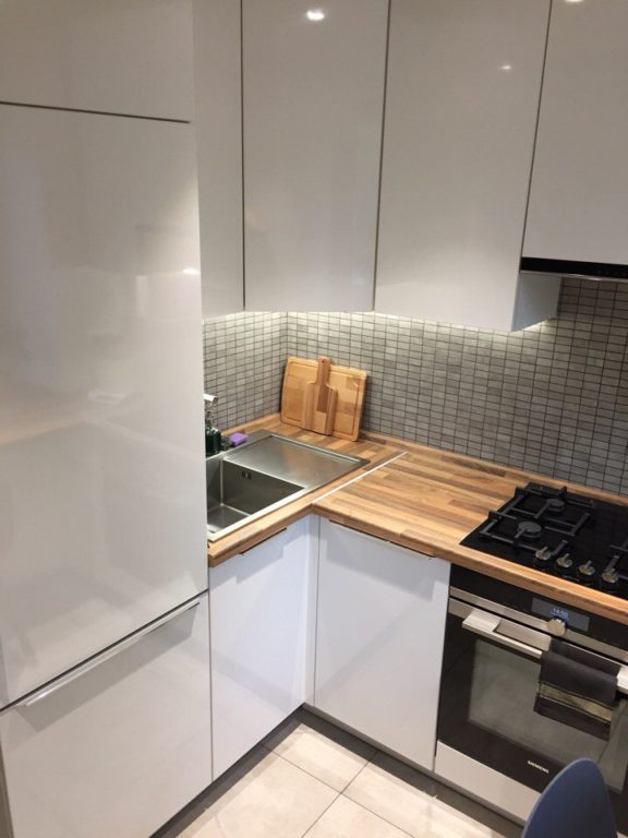 very small white corner kitchen