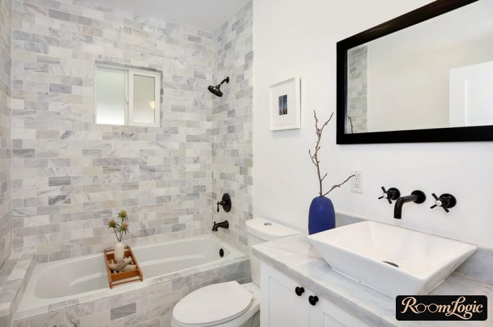 wall-mounted faucet in a small bathroom