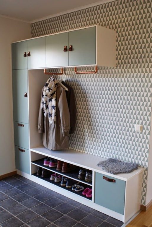 wallpaper and open closet in entryway