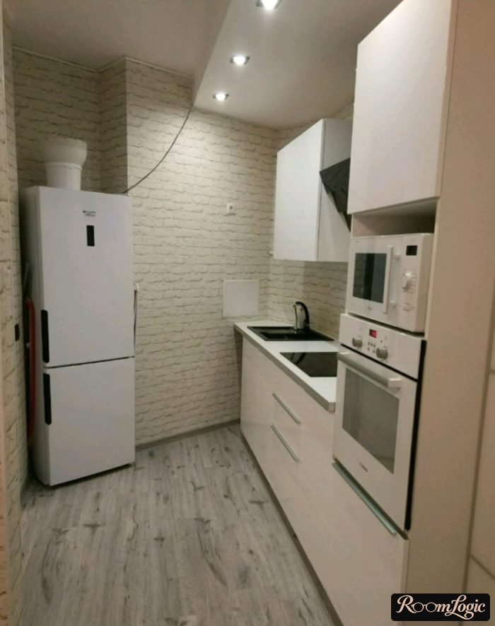 wallpaper with white brick imitation on all kitchen walls