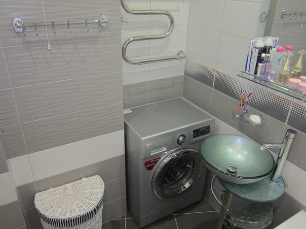washer in bathroom of one-bedroom apartment