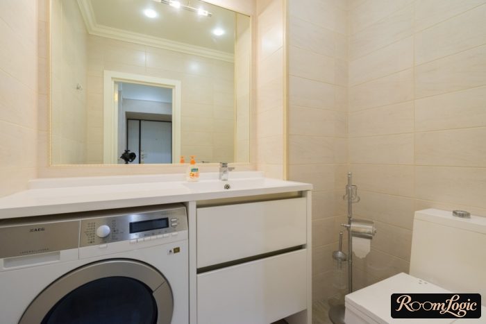 washer under sink in bathroom