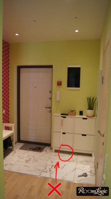 White boot shelf on legs in small entryway