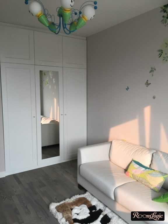 White closet with mirror up to the ceiling in the children's room