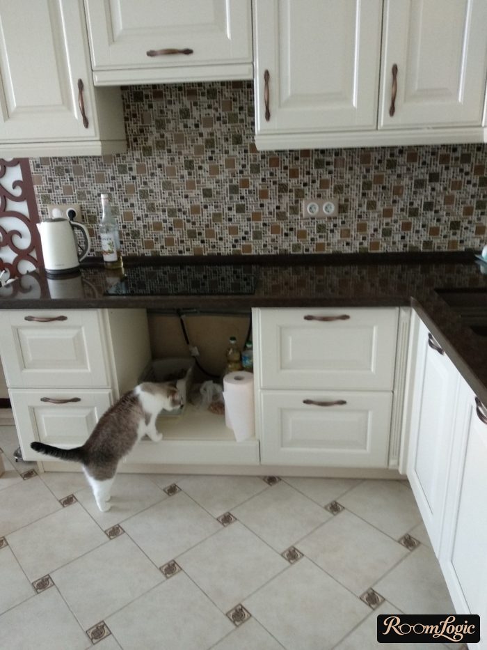 White corner kitchen with black countertop