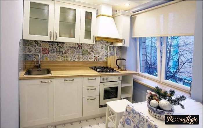 White curtains on all windows in the kitchen