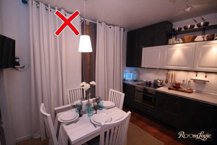 White curtains on rails in the kitchen