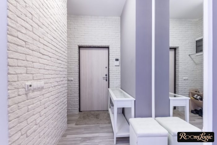 White decorative brick in a small entryway