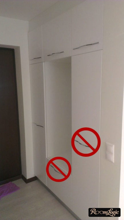 White entryway with hinged doors and non-contemporary handles