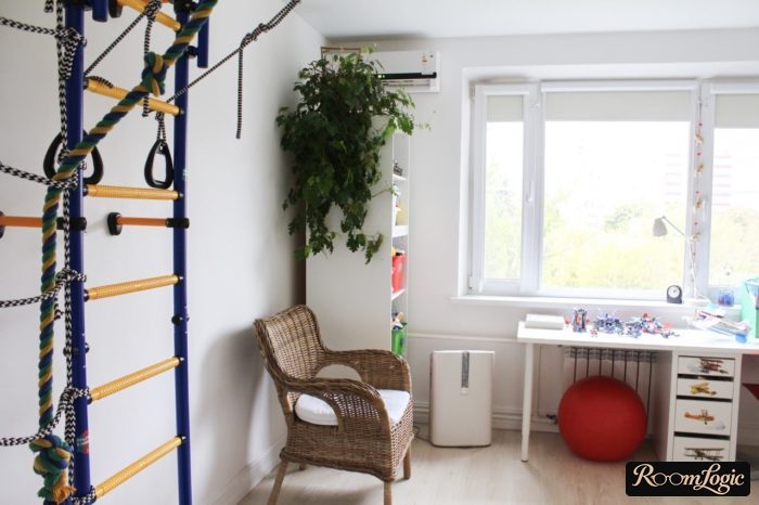 White furniture and a pull-up bar in a 13-year-old boy's room