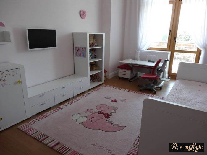 White furniture and pink carpet in the kids’ room