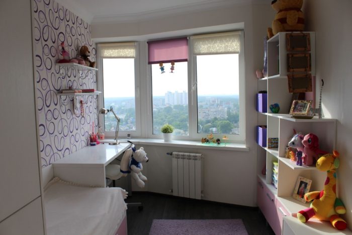 White glossy furniture in a girls' room
