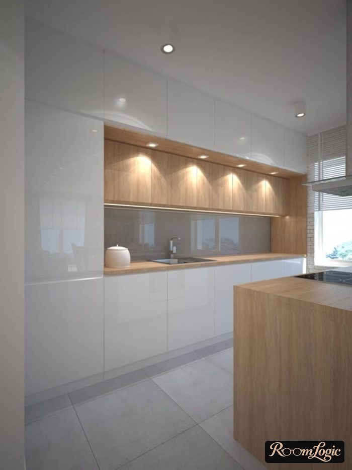 White glossy kitchen cabinets up to the ceiling with wooden countertop