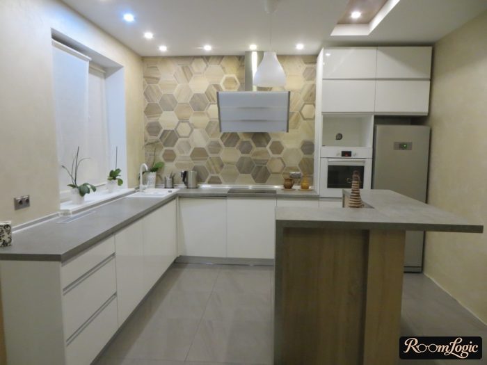 White glossy kitchen with no upper cabinets and a peninsula