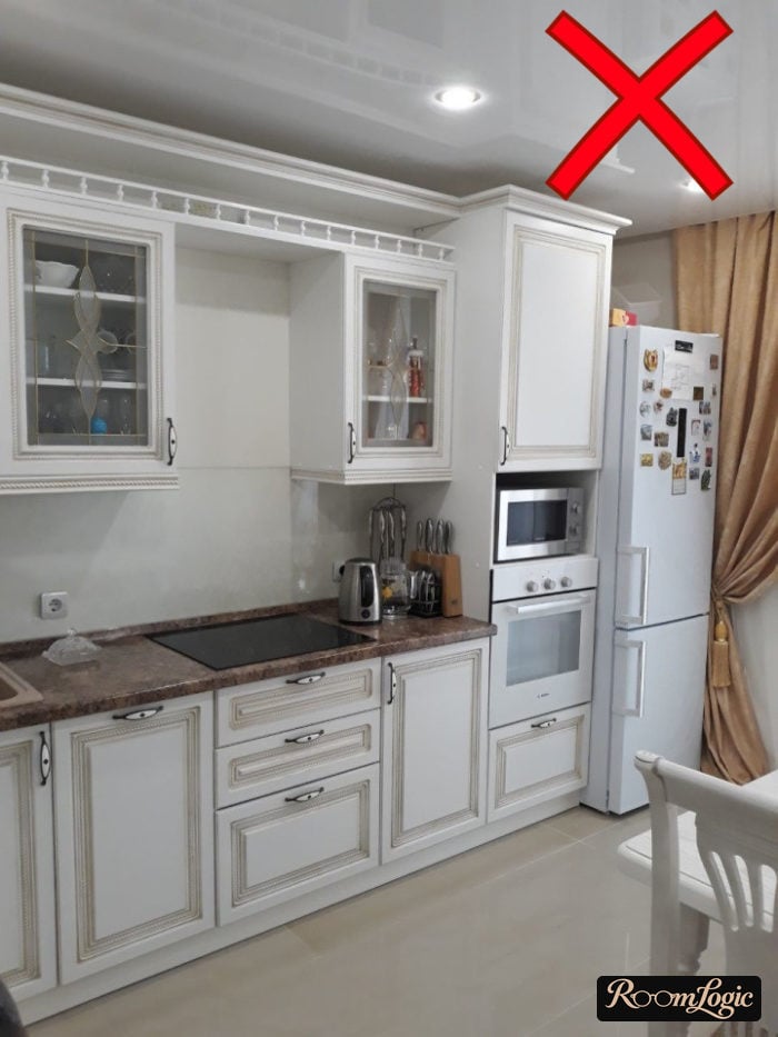 white glossy stretch ceiling in a classic kitchen