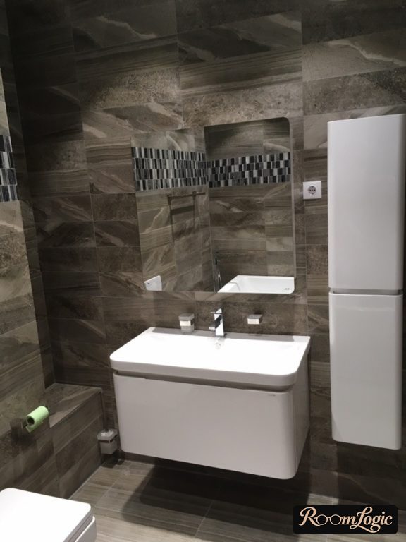 white glossy vertical wardrobe in the bathroom