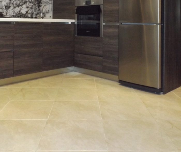 White grout on the tile floor of the kitchen
