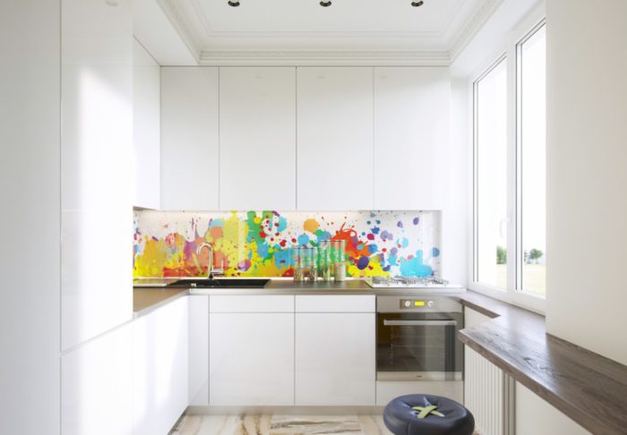 White kitchen in a tiny apartment in a minimalist style