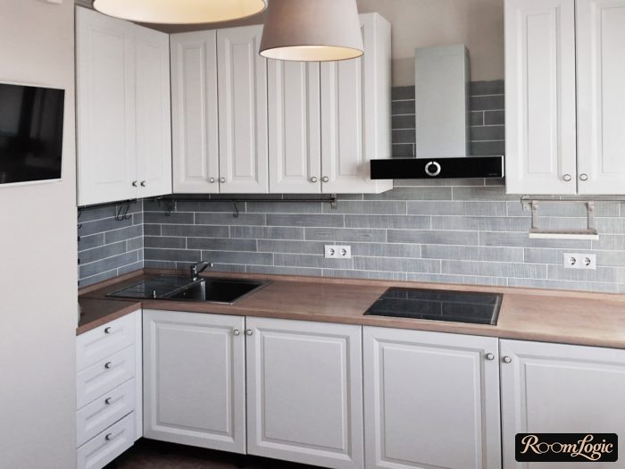 White kitchen in neoclassical style with beige finish