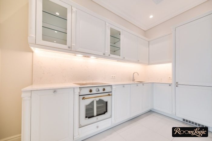 White kitchen in neoclassical style with vintage oven