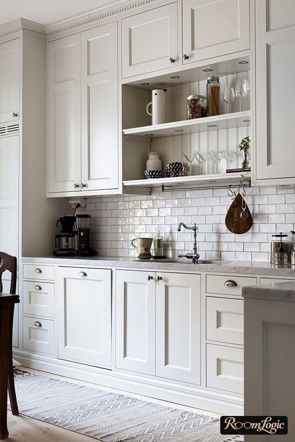 White kitchen in Provence style up to the ceiling