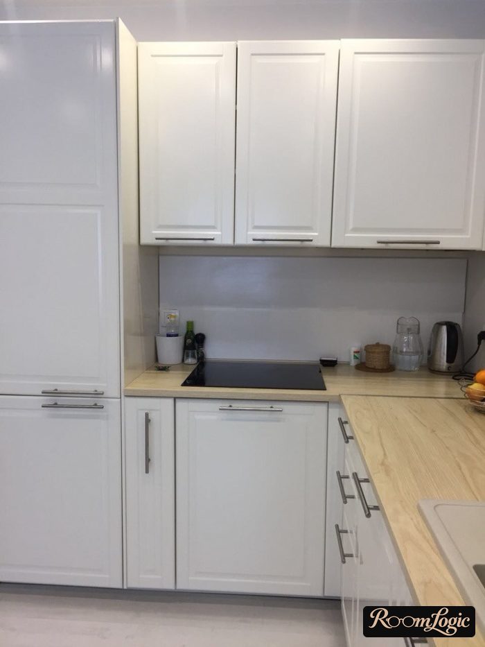 White kitchen in Scandinavian style with light wood-look countertop