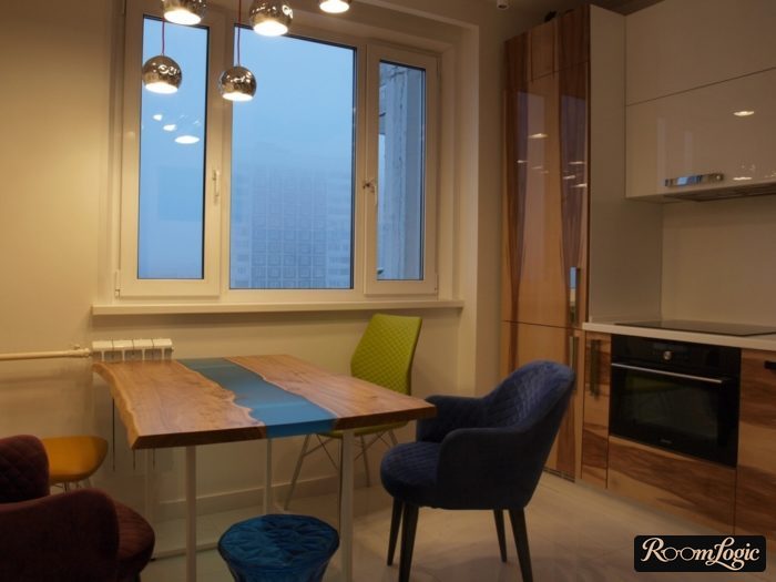 White kitchen with a wood-and-glass table