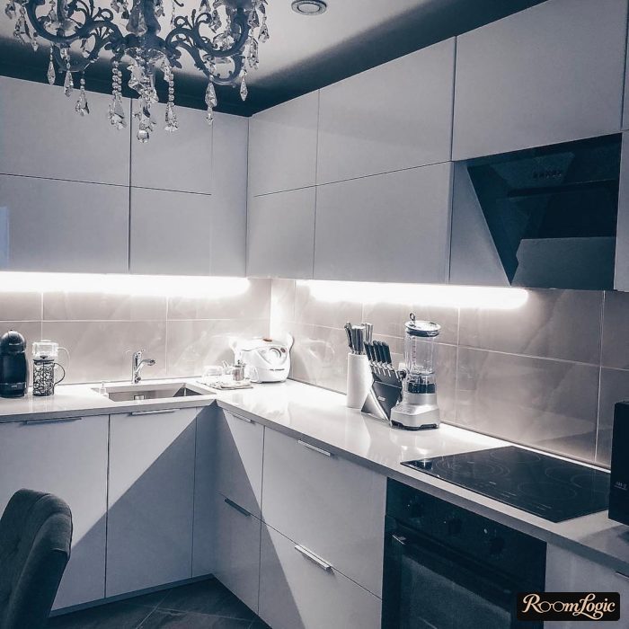 white kitchen with sink in the corner