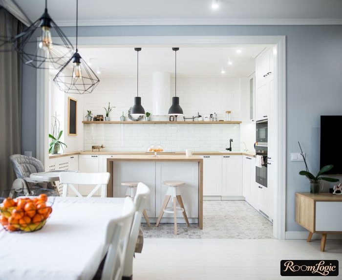 white kitchen with wood-look countertop and no upper cabinets