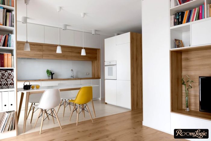 White kitchen with wooden countertop and ceiling-to-floor drawers