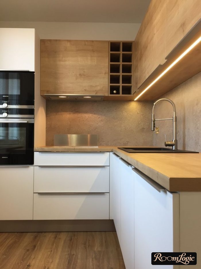 White kitchen with wooden countertop and concrete backsplash